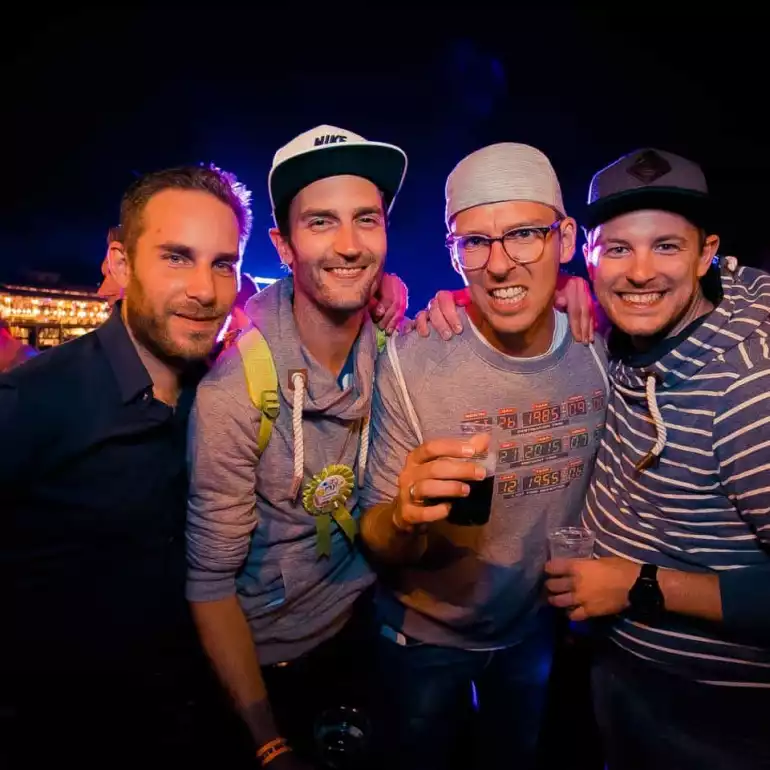 Found guys enjoying drinks during a Budapest pub crawl.